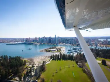 Seaplane over Coal Harbour - Patrick Kuschfeld - Harbour Air Seaplanes