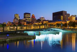 A bridge in front of the Montreal skyline