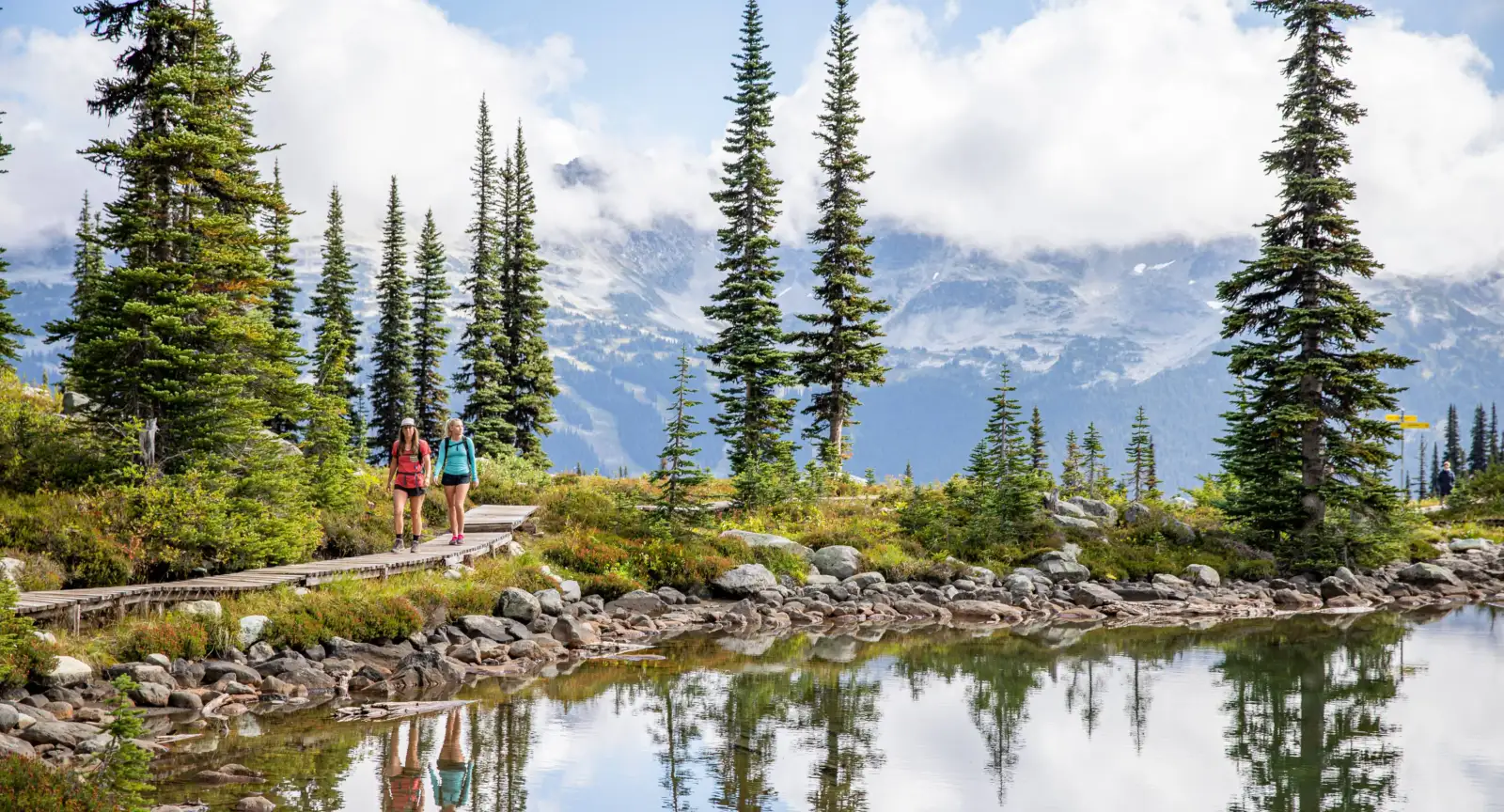 A pair hike through the mountains in Whistler, Canada
