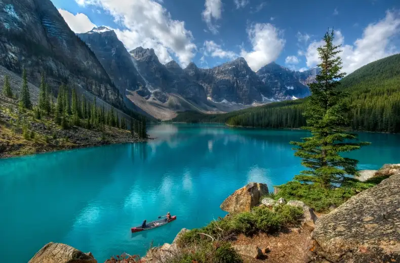 Two people kayaking Moraine Lake in Banff National Park